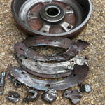 Ifor Williams trailer brakes with damaged brake drum and detached brake shoes